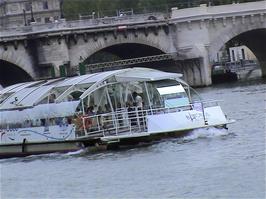 A Batobus passes us on the River Seine in Paris